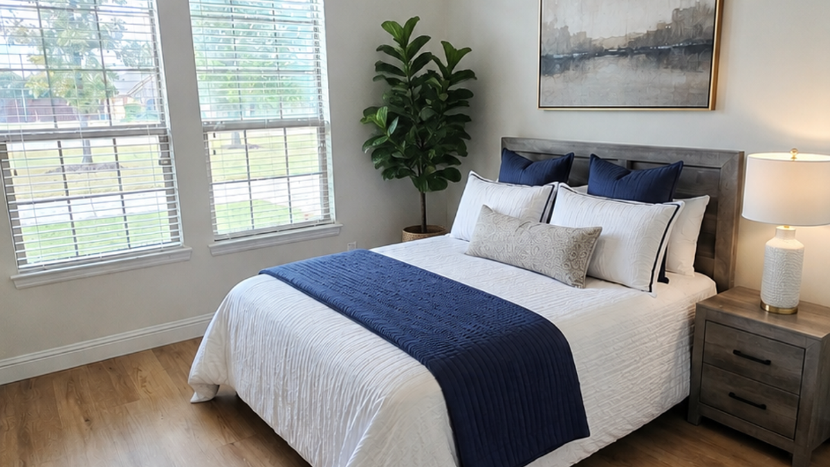 Bedroom suite with soft natural light at Grand Pleasantville